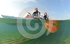 Two young women smiling in kayak