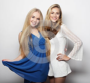 Two young women in summer fashion dress