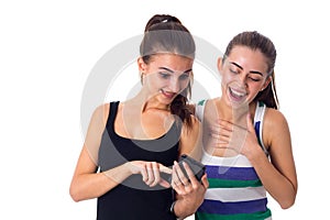 Two young women using smartphone