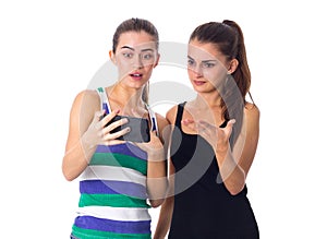 Two young women using smartphone