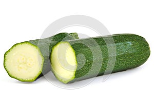 Two zucchini halves on white background