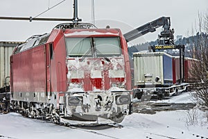 TXL 185 404-1 with freight train transit in Halden