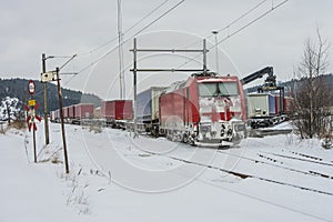 TXL 185 404-1 with freight train transit in Halden