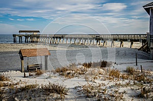 Tybee Island pier in Southern Georgia United States on the beach of the Atlantic Ocean, and a swing