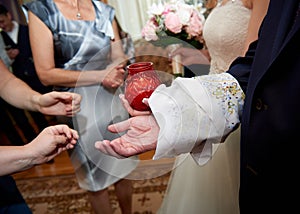 Tying arms of newlywed russian wedding tradition