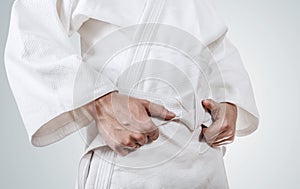 Tying kimono belt close up image