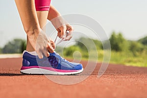 Tying sports shoe