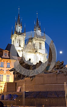 Tyn Church and statue monument Jan Hus at night Old Town Square