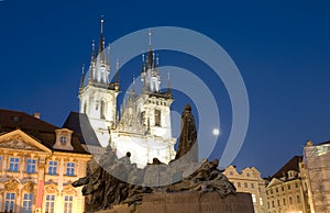 Tyn Church and statue monument Jan Hus at night Old Town Square