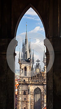Tyn Church through window of Old Town Hall in Prague