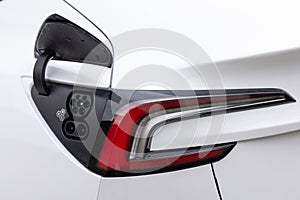 Type 2 CCS plug port on electric vehicle. DC - CCS type 2 EV charging connector at EV car. Fast charging socket type 2