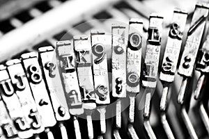 Type bars of typewriter with some type bars unfocused