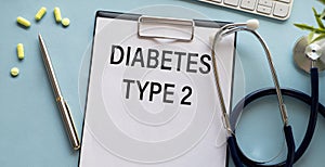 Type 2 diabetes diagnosis form with stethoscope and pills on blue background. Diabetes concept