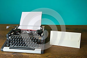 Typewriter and blank envelope