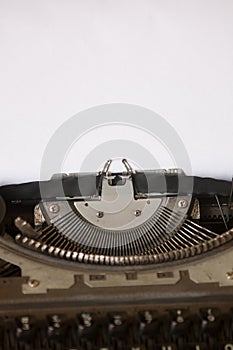 Typewriter with blank white paper