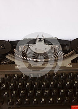 Typewriter with blank white paper