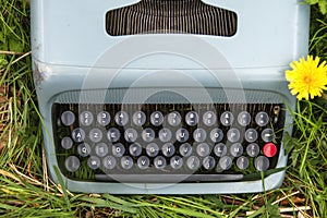 Typewriter on the grass