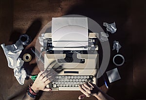 Typewriter hands tools paper above shadows