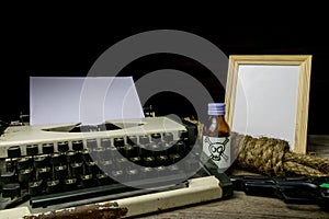 Typewriter with paper page and poison and gun. Concept writer Romance Suspense