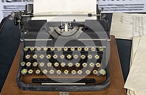 Typewriter with paper sheet.