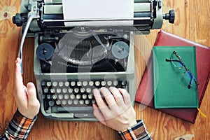 Typewriter retro hand on wooden table