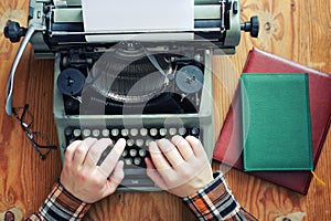 Typewriter retro hand on wooden table