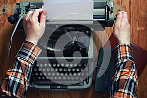 Typewriter retro hand on wooden table