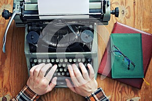 Typewriter retro hand on wooden table