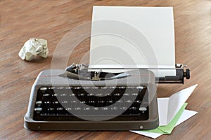 Typewriter on a table with letterhead paper