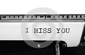 Typewriter. Typing text: i miss you