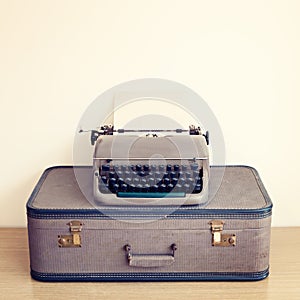 Typewriter and vintage suitcase