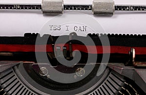 Typewritten YES I CAN  with vintage typewriter symbolizing the possibility of always succeeding