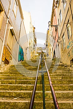 Lisboa, Portugal, a typic alley with long and steep staircases in Mouraria neighborhood photo