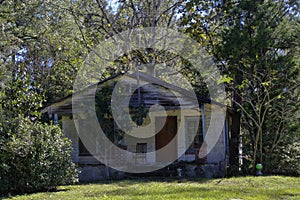 Typical abandoned small old wooden bungalow at Tallahassee suburbs on October 24, Florida