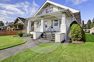 Typical American craftsman style house with column porch