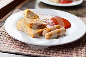 A typical American hearty breakfast with sausage, ham, Omelette