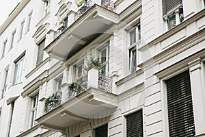 A typical apartment building in Berlin with balconies. Exterior of a multifamily urban house