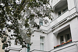 A typical apartment building in Berlin with balconies. Exterior of a multifamily urban house