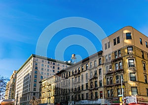 Typical apartment buildings in New York City`s borough of Manhattan on a beautiful sunny day