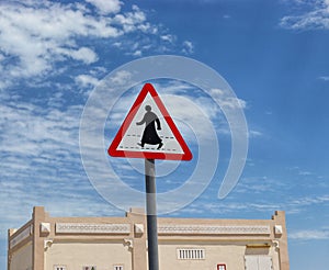 typical arabic pedestrian crossing,the crosswalk sign on blue background