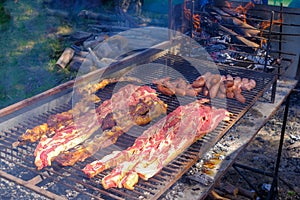 Typical argentinean asado parillada BBQ on a grill in Uruguay, also seen in Argentina, Brazil and Chile