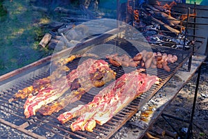 Typical argentinean asado parillada BBQ on a grill in Uruguay, also seen in Argentina, Brazil and Chile photo