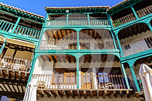 Typical balconies in the central square of Chinchon in Madrid, old wooden balconies in all the houses