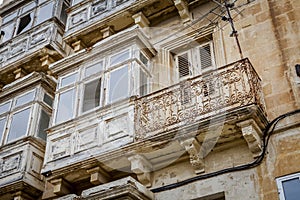 Typical balconies in the streets of Valetta, Malta