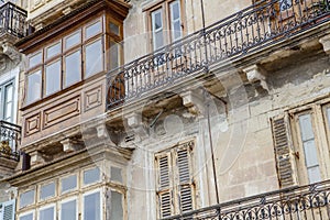 Typical balconies in the streets of Valetta, Malta