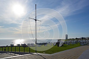 Typical beach chairs on the lawn at the north sea coast in bÃ¼sum, the famous tourism resort in Schleswig-Holstein Germany, copy