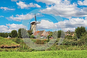 Typical beautiful idyllic dutch countryside landscape, small rural village with old windmill, lake and green meadow - Terheijden