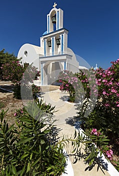A typical blue domed church situated at Exo Gonia on the Greek island of Santorini photo