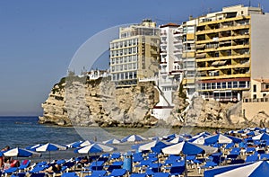 Typical blue sunbeds on the Benidorm beach with balcon del mar , Alicante - Spain