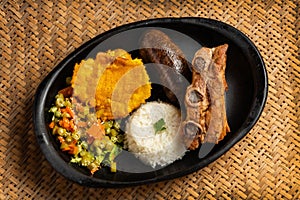 Typical Boyacense food - Peasant roast with baked pork rib, blood sausage, patacon, white rice and salad